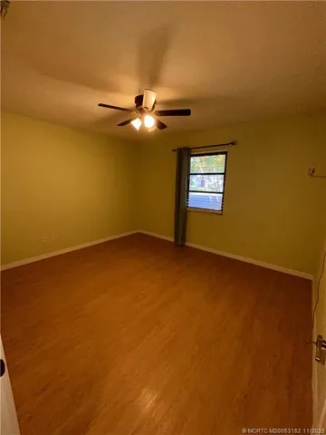 a view of empty room with windows