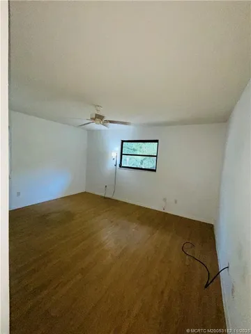 an empty room with a empty space and windows