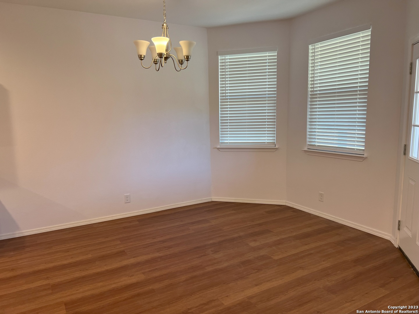 141 Wright Cove Cibolo, TX 78108 - Photo 13 of 35 wooden floor in an empty room with a window