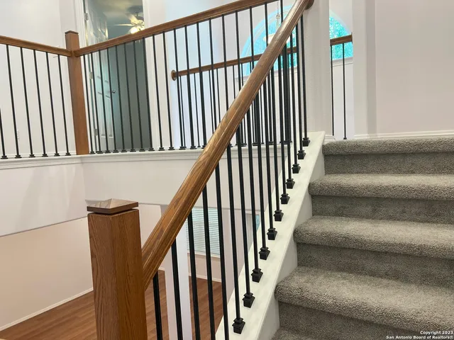 an empty room with closet and fan