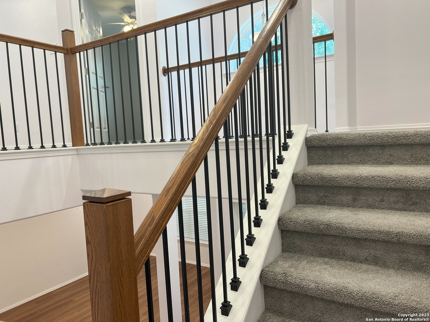 141 Wright Cove Cibolo, TX 78108 - Photo 18 of 35 a view of staircase with lots of wooden floor