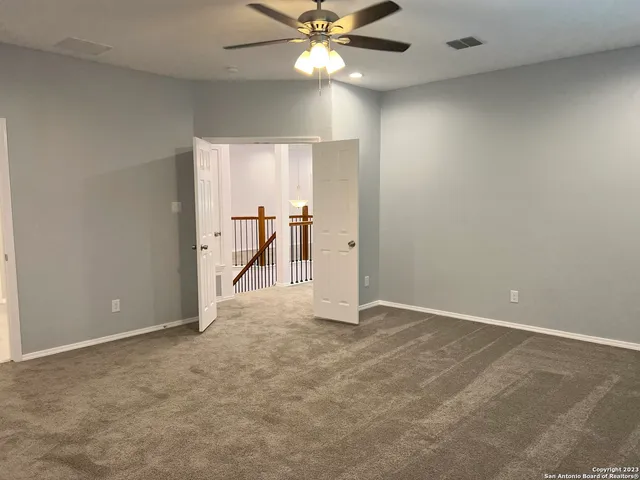 a bathroom with a sink vanity and a mirror