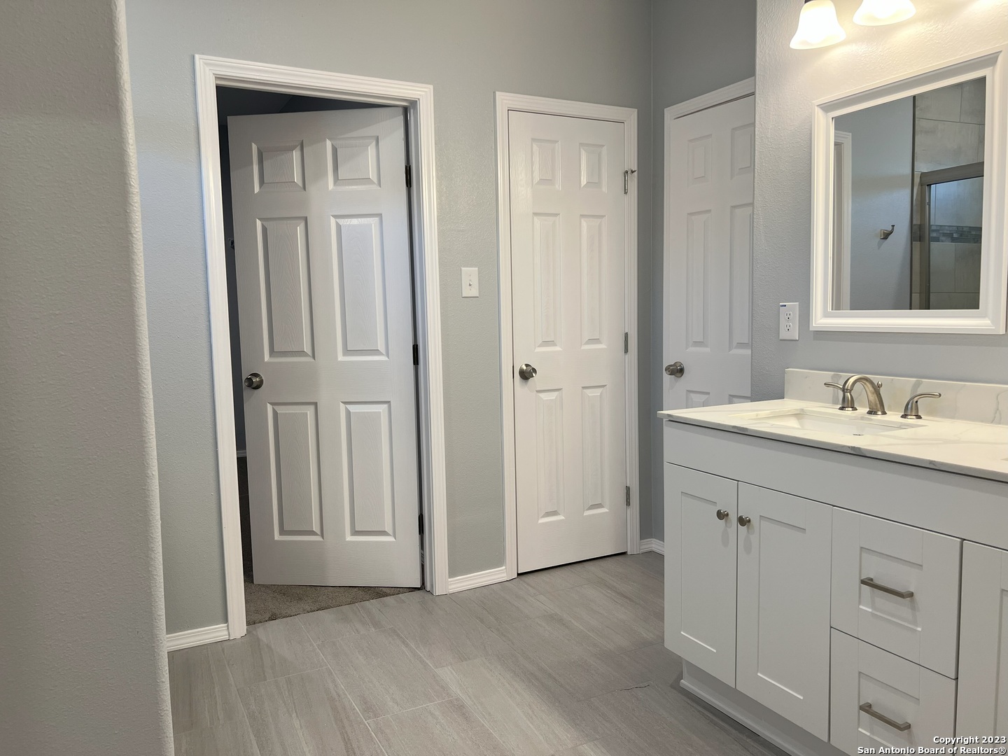 141 Wright Cove Cibolo, TX 78108 - Photo 22 of 35 a bathroom with a sink vanity and a mirror