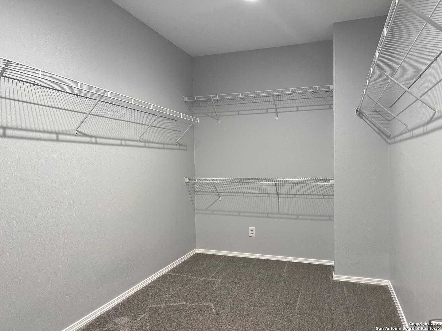 141 Wright Cove Cibolo, TX 78108 - Photo 24 of 35 a view of a room with racks on the wall
