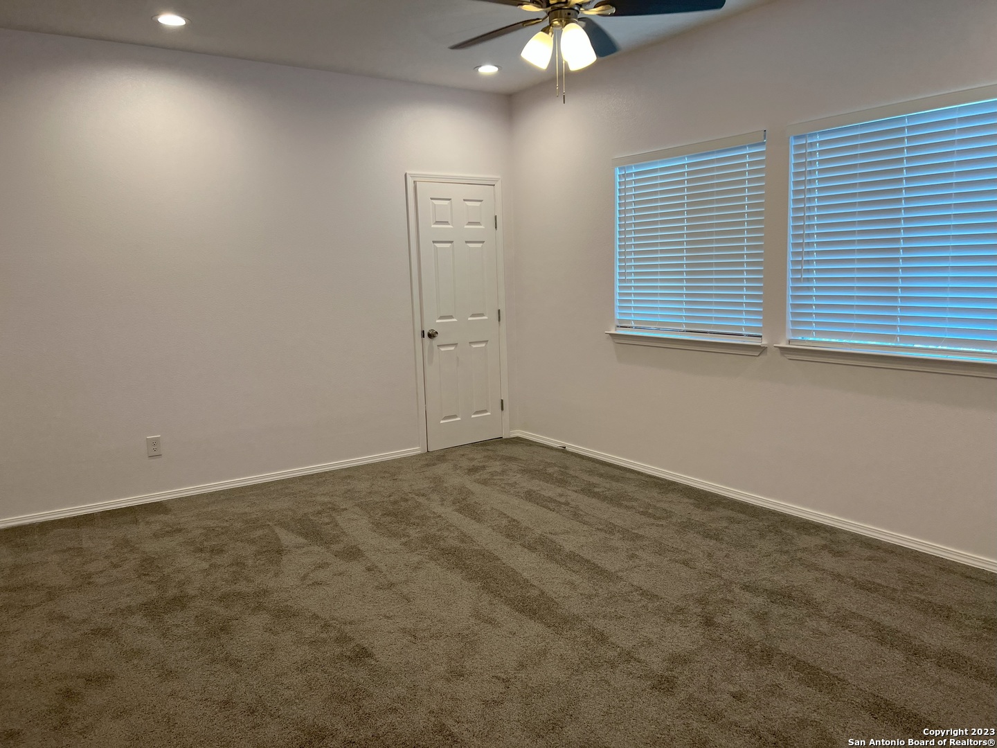 141 Wright Cove Cibolo, TX 78108 - Photo 27 of 35 an empty room with windows and fan