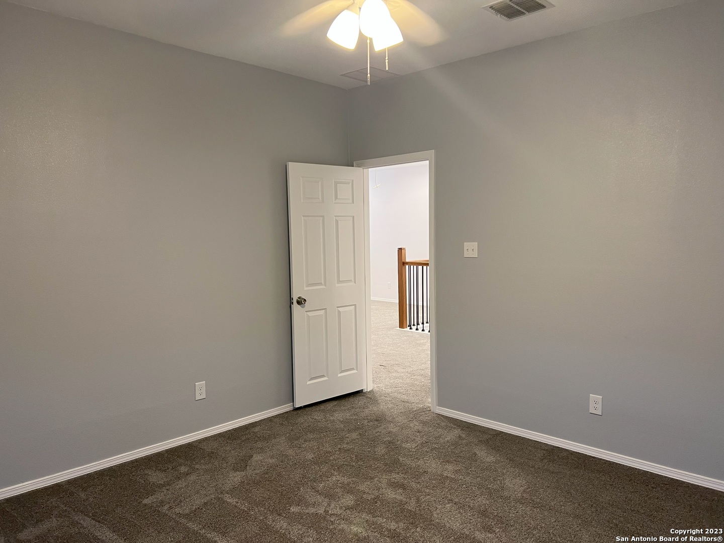 141 Wright Cove Cibolo, TX 78108 - Photo 32 of 35 an empty room with a chandelier fan