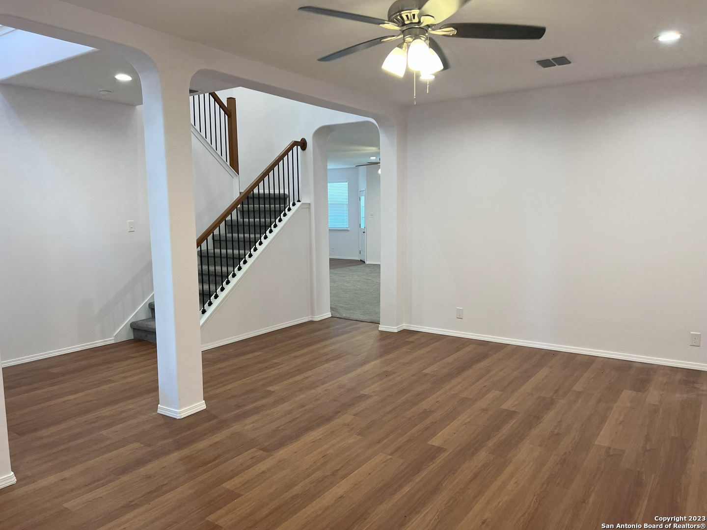 141 Wright Cove Cibolo, TX 78108 - Photo 5 of 35 wooden floor in an empty room with a window