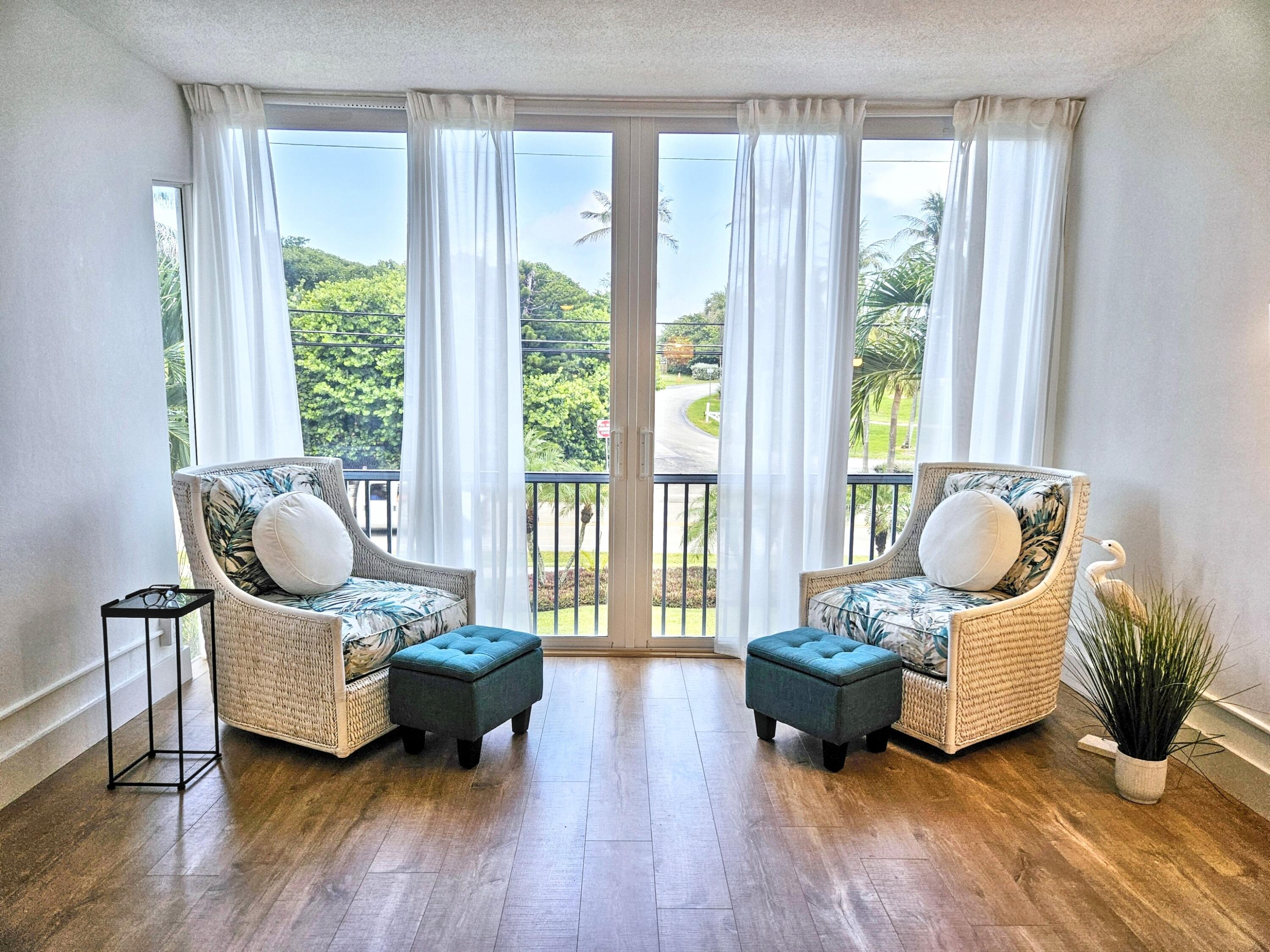 6530 North Ocean Boulevard, Unit 205 Ocean Ridge, FL 33435 - Photo 20 of 53 a living room with furniture and wooden floor
