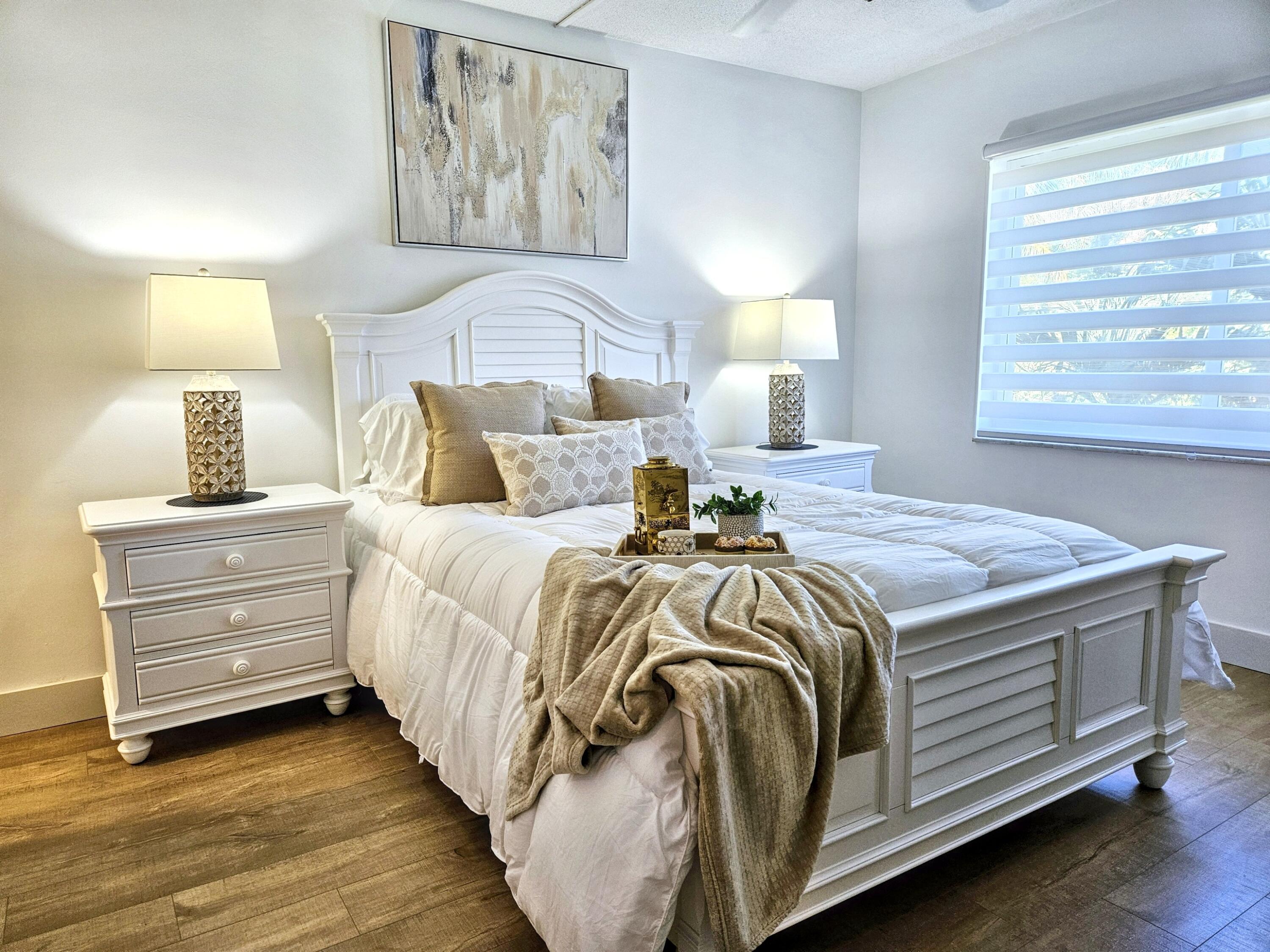 6530 North Ocean Boulevard, Unit 205 Ocean Ridge, FL 33435 - Photo 22 of 53 a bedroom with a bed and lamp