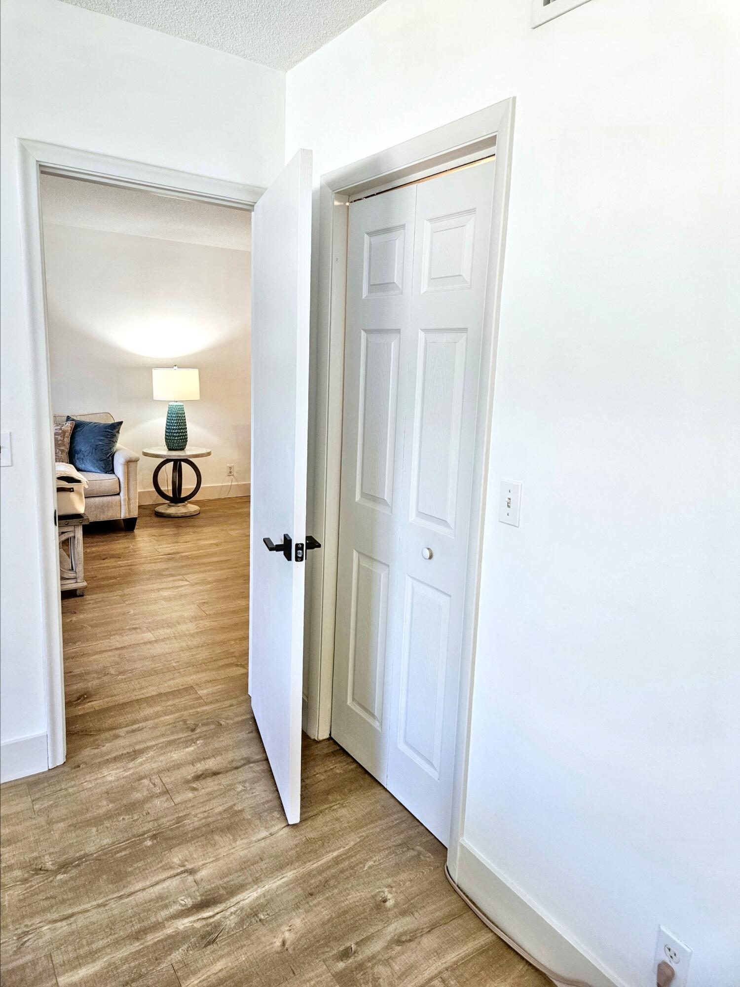 6530 North Ocean Boulevard, Unit 205 Ocean Ridge, FL 33435 - Photo 28 of 53 a view of a livingroom with wooden floor and a couch