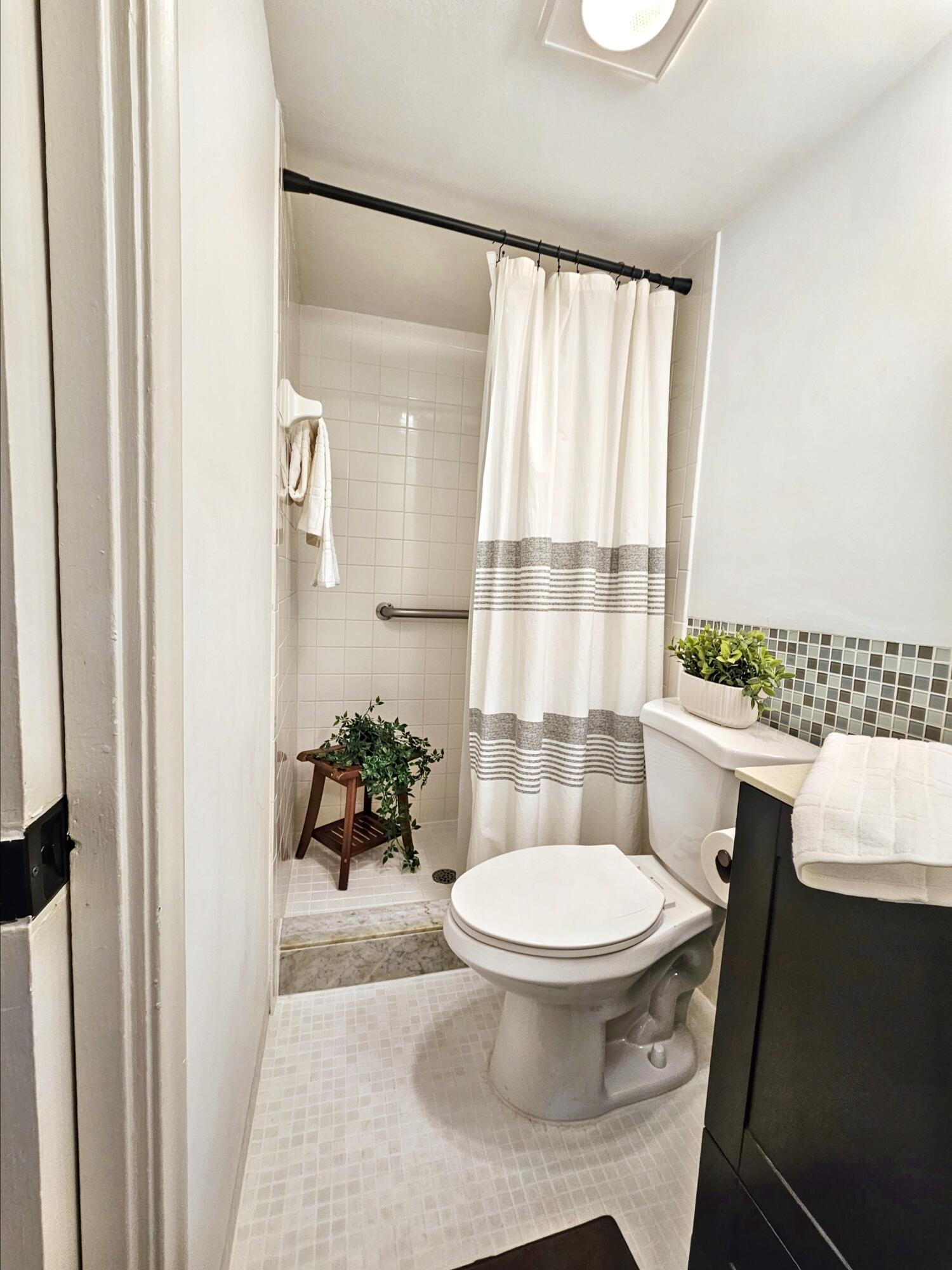 6530 North Ocean Boulevard, Unit 205 Ocean Ridge, FL 33435 - Photo 32 of 53 a bathroom with a sink toilet and shower