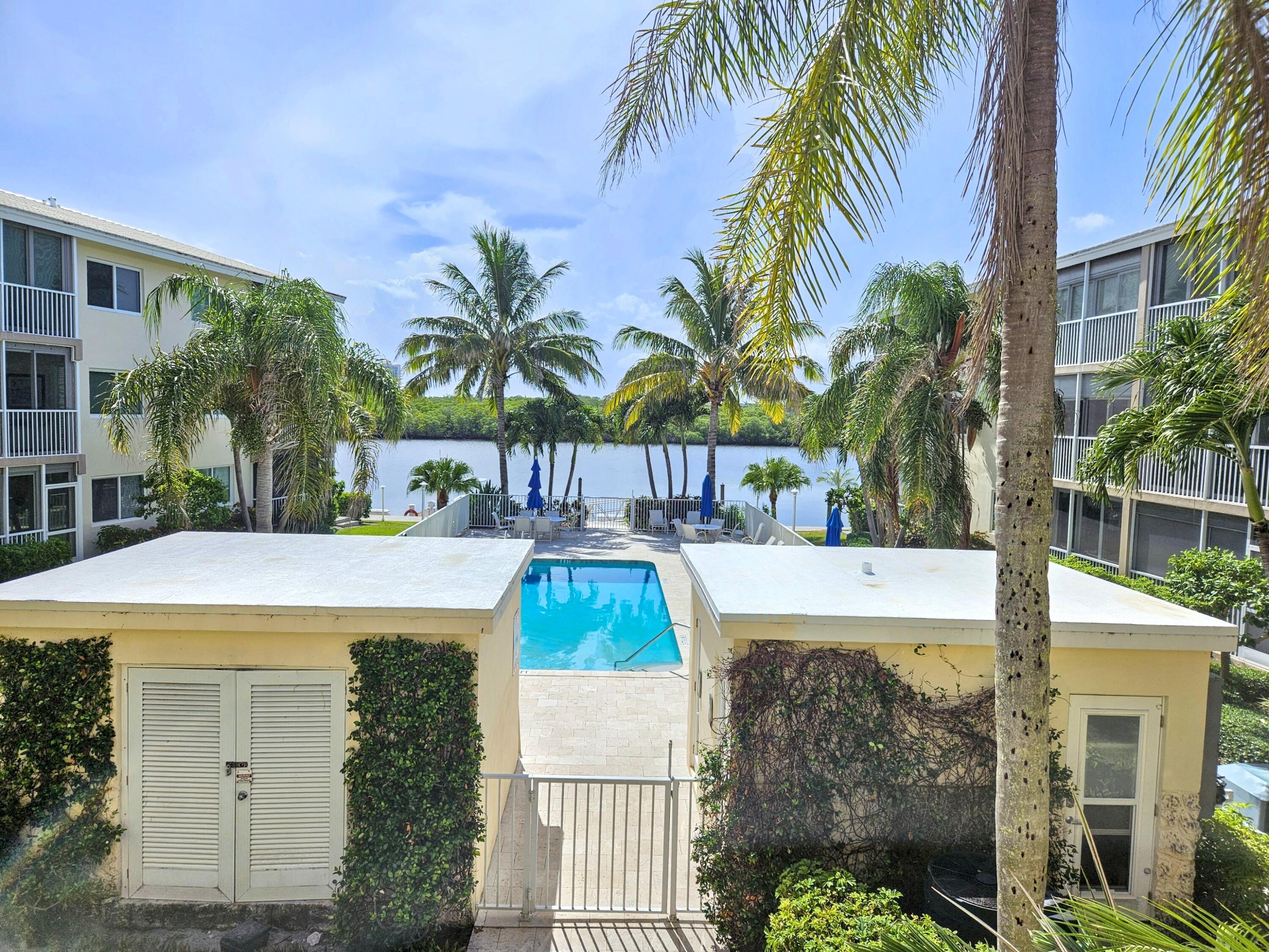 6530 North Ocean Boulevard, Unit 205 Ocean Ridge, FL 33435 - Photo 34 of 53 a view of a house with a swimming pool