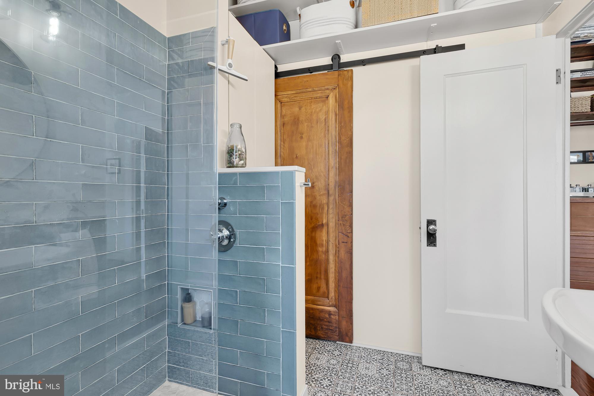 1860 California Street Northwest, Unit 403 Washington, DC 20009 - Photo 17 of 52 Designer blue glass shower and wall tile