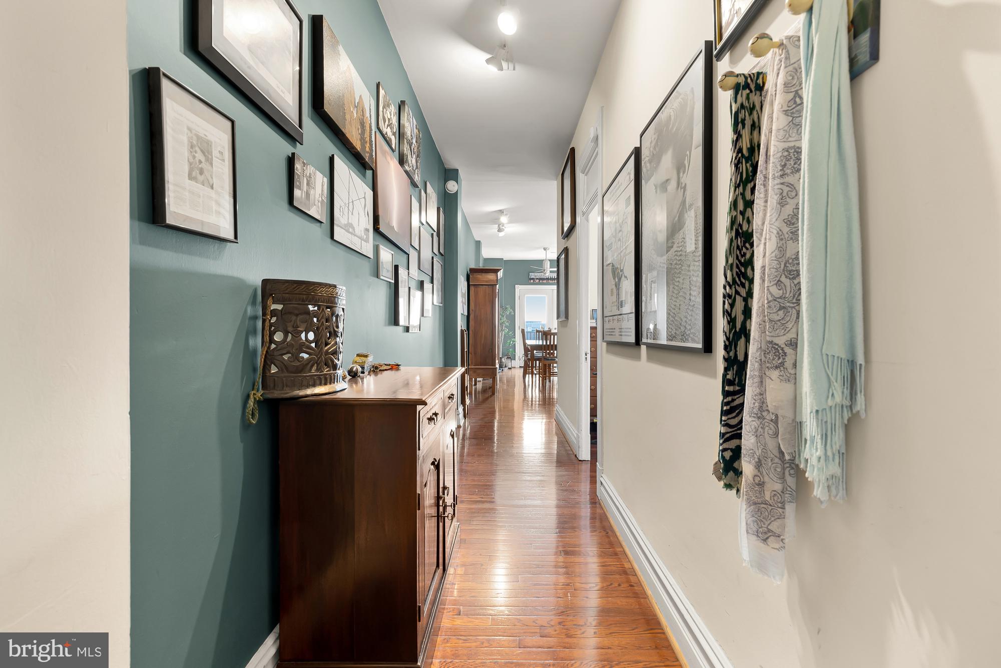 1860 California Street Northwest, Unit 403 Washington, DC 20009 - Photo 4 of 52 Front entry gallery wall w/view to back of apt