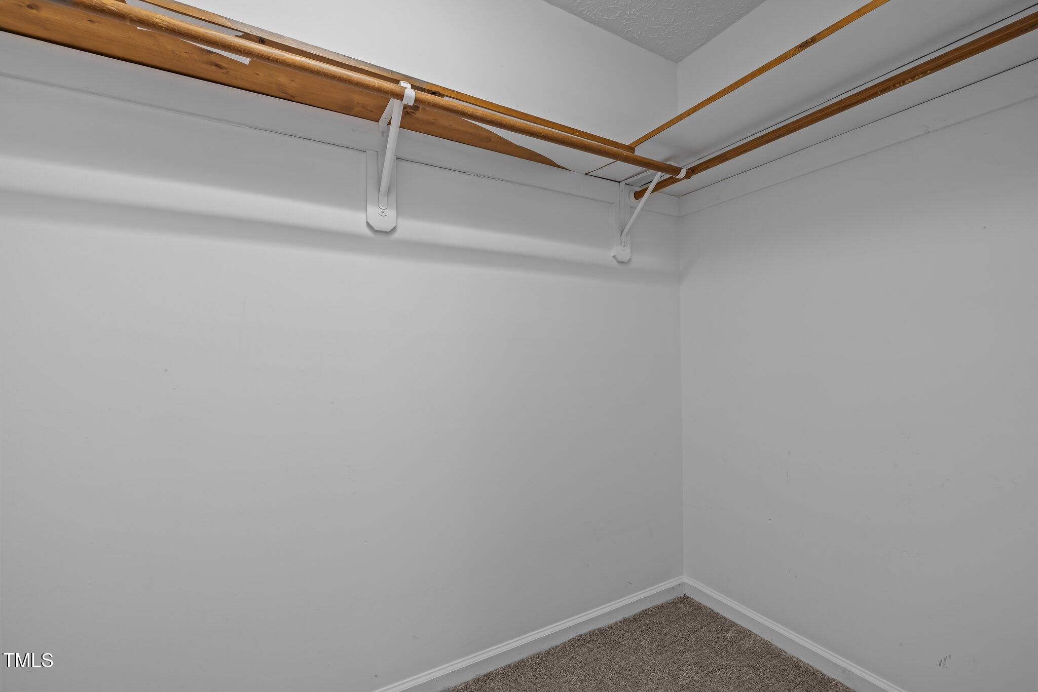 5801 Hadrian Drive Durham, NC 27703 - Photo 26 of 40 a view of a room with racks on the wall