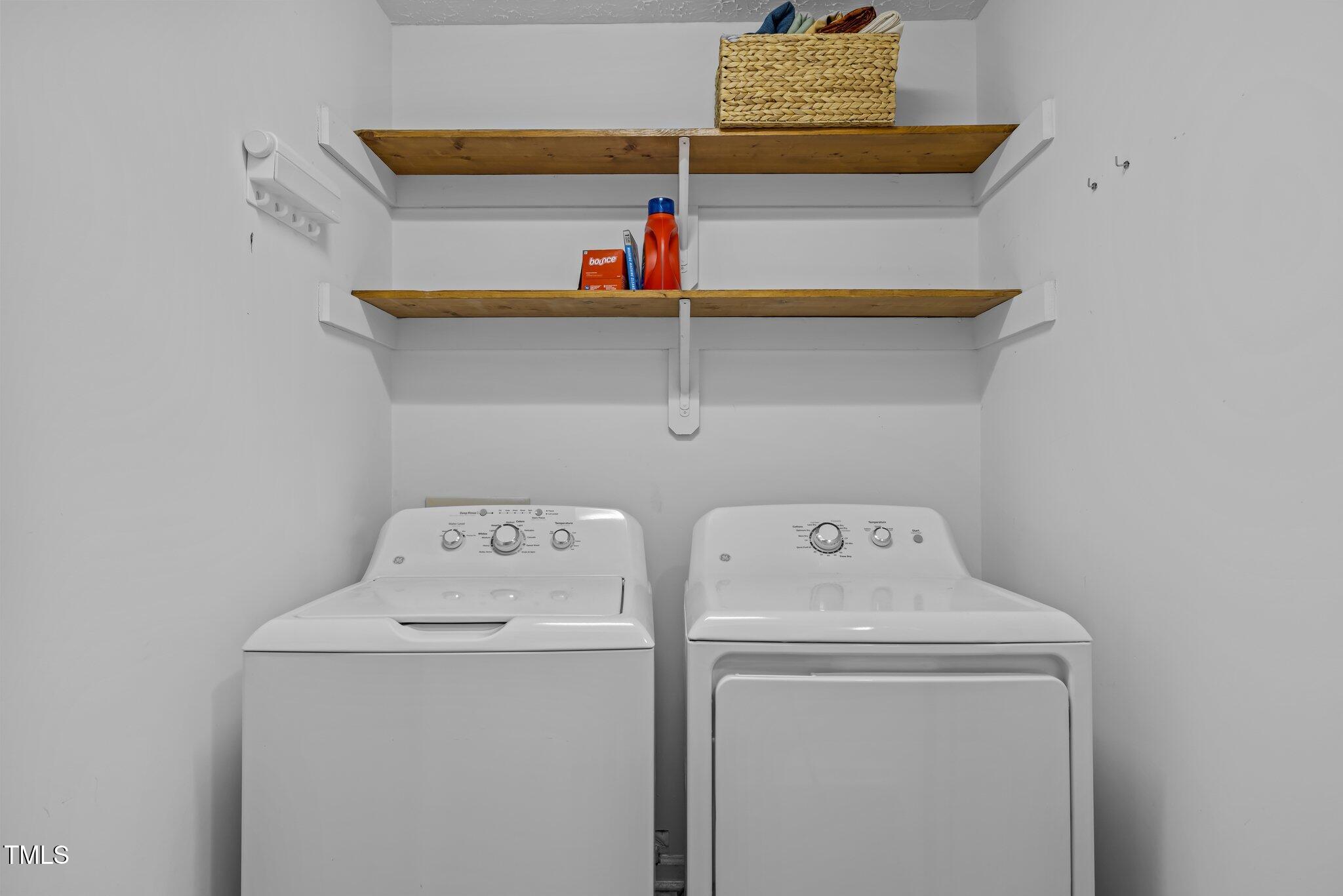 5801 Hadrian Drive Durham, NC 27703 - Photo 27 of 40 a utility room with dryer and washer