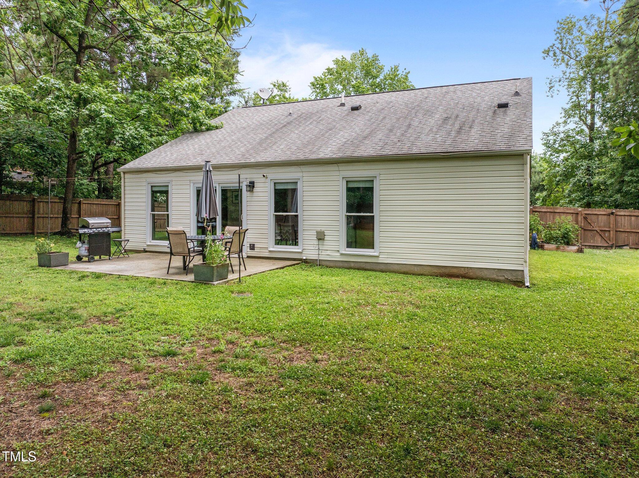 5801 Hadrian Drive Durham, NC 27703 - Photo 30 of 40 a view of outdoor space yard and patio
