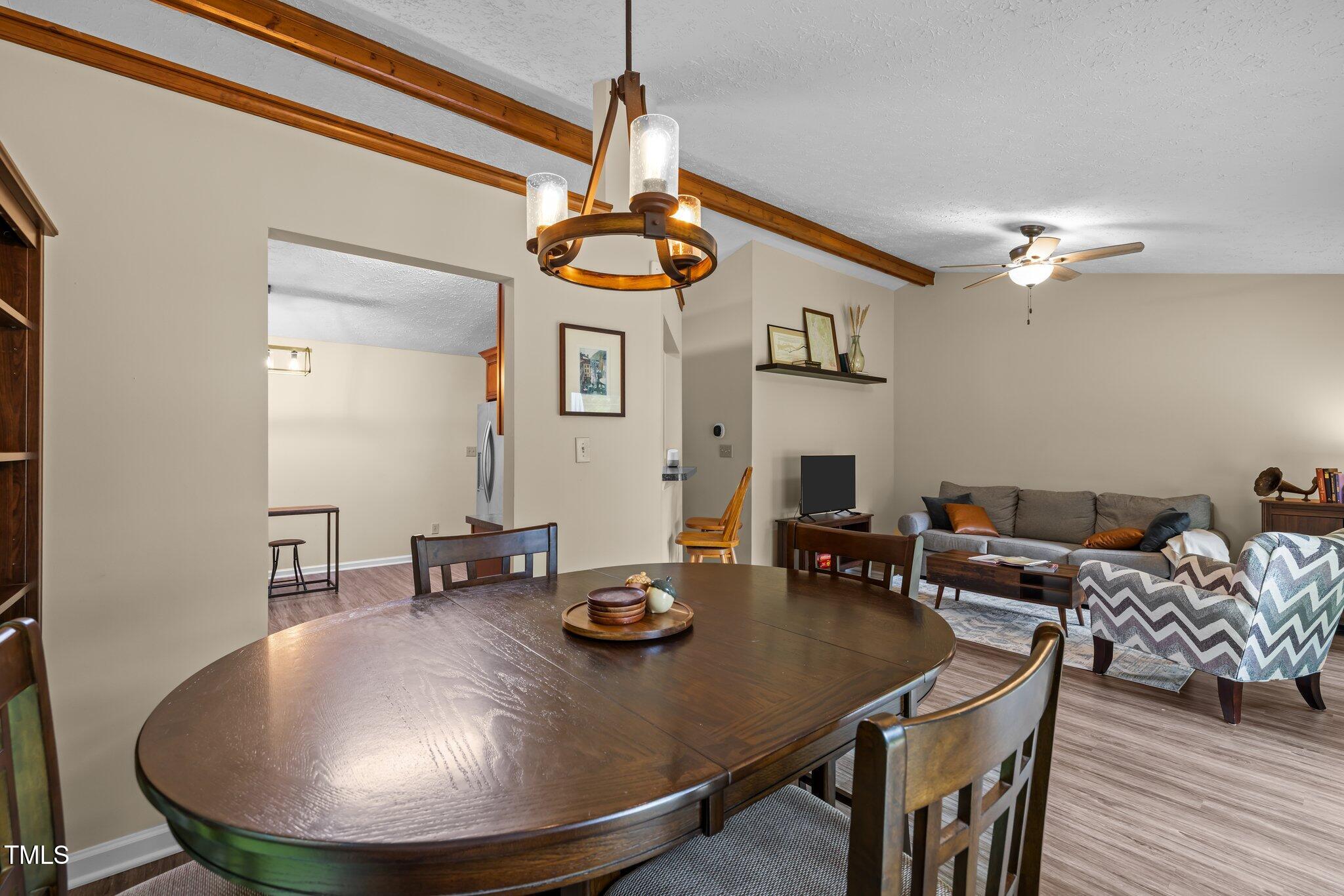 5801 Hadrian Drive Durham, NC 27703 - Photo 5 of 40 a view of a dining room with furniture