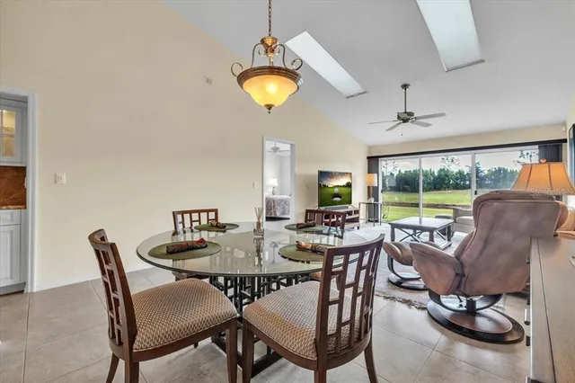 a kitchen with granite countertop white cabinets and a sink