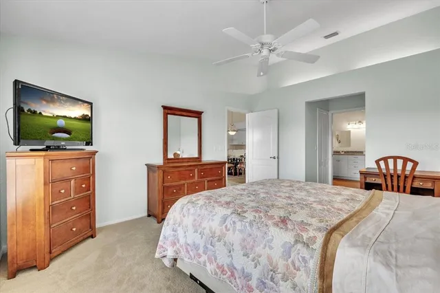 a bedroom with a bed and a mirror