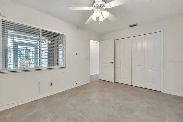 an aerial view of residential houses with outdoor space and lake view