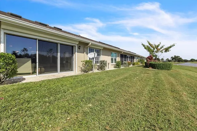 an aerial view of a tennis ground and a fountain