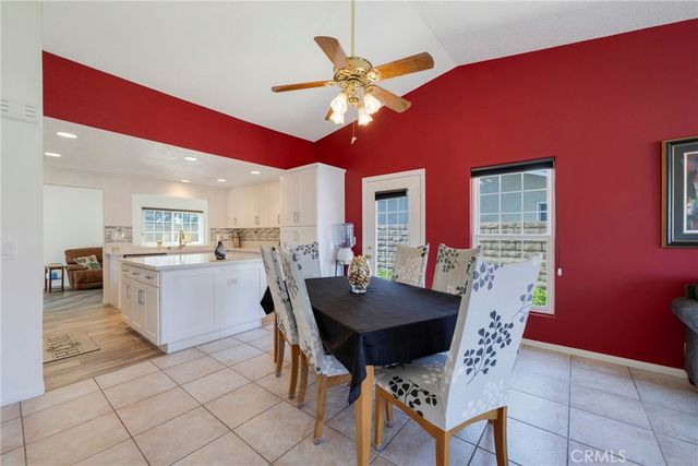 a view of a dining room with furniture and window