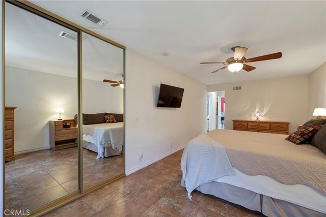 a room with a large bed and a window