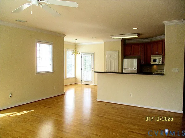 a view of a kitchen with a sink and a window