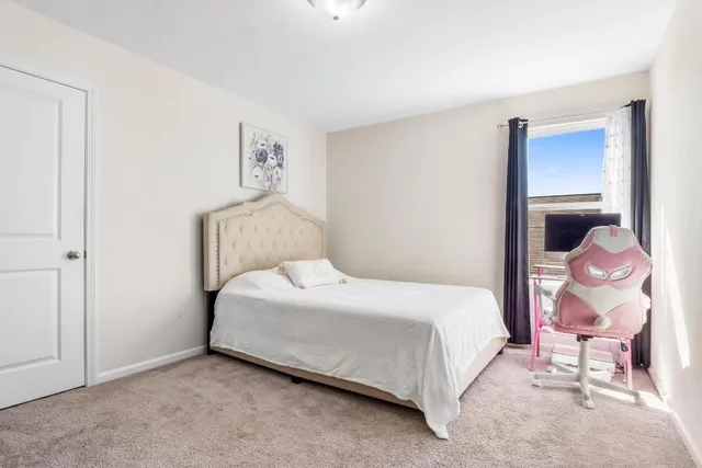an aerial view of a house with a swimming pool