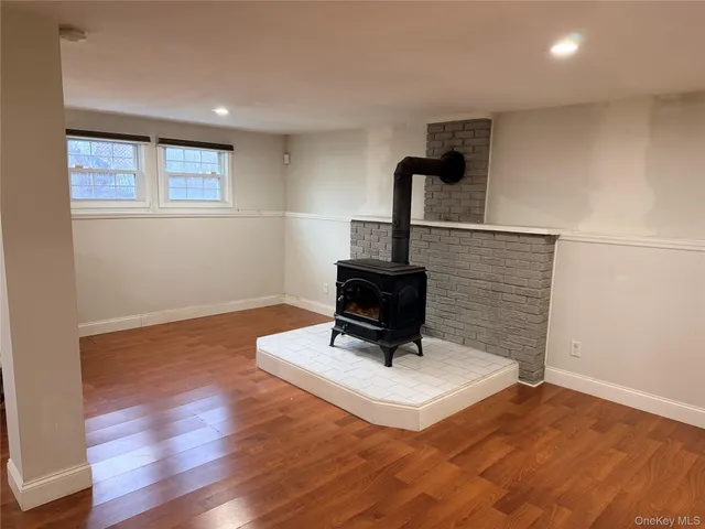 a living room with furniture and a lamp