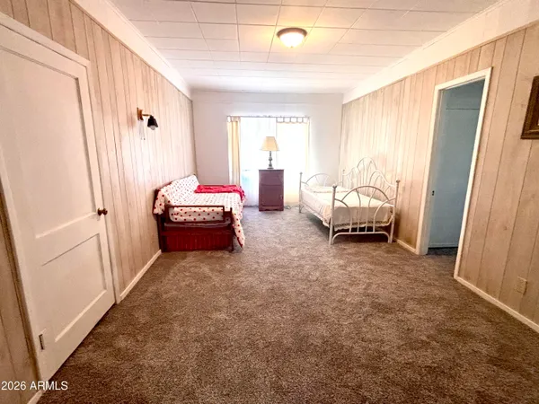 a bed room with double bed and a window