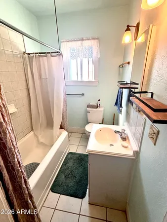a bathroom with a tub and shower