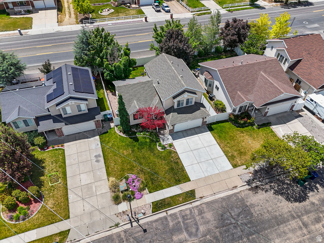 142 East 2675th Street South Clearfield, UT 84015 - Photo 39 of 49 Aerial perspective highlighting a residential street with multiple properties