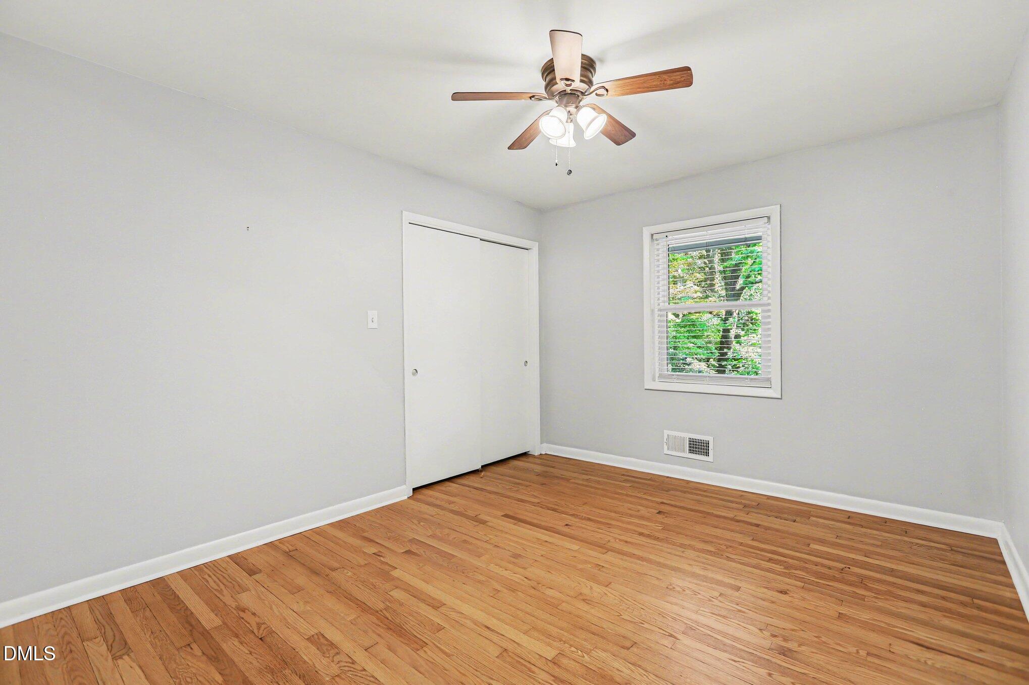 2600 Wade Avenue Raleigh, NC 27607 - Photo 11 of 31 wooden floor in an empty room with a window