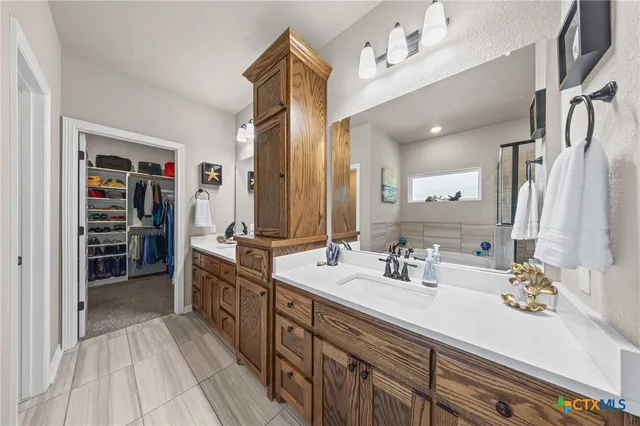 a bathroom with a sink and a shower