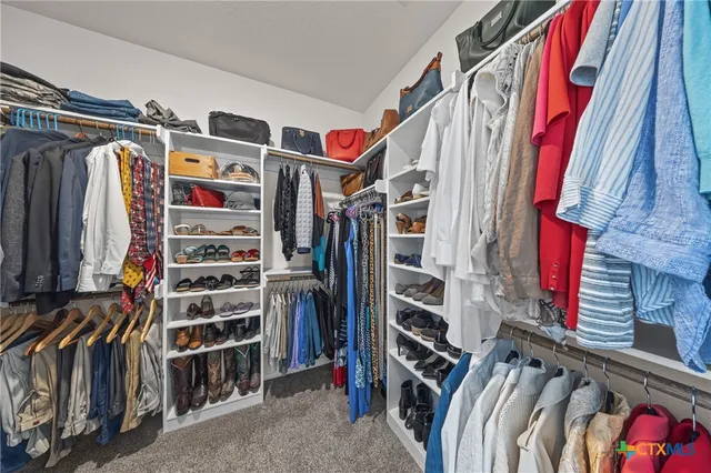 a view of a livingroom with furniture and a fireplace