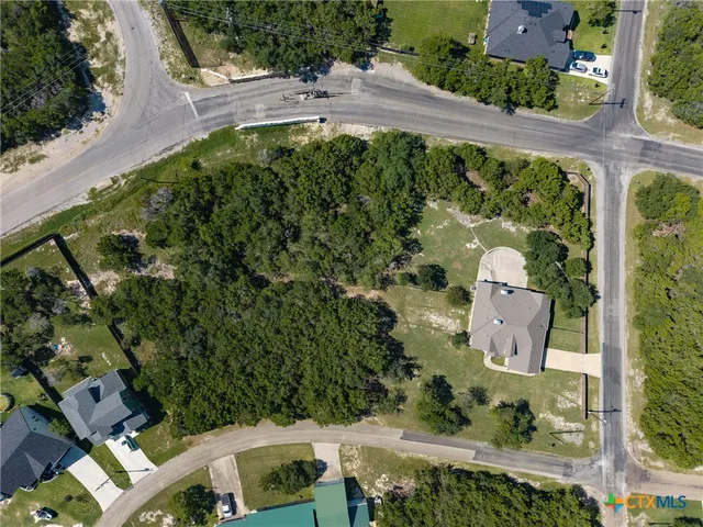 an aerial view of a house with yard swimming pool and outdoor seating