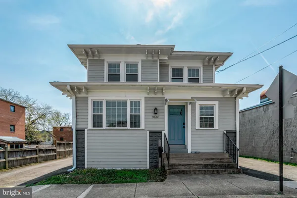 a front view of a house with a garage