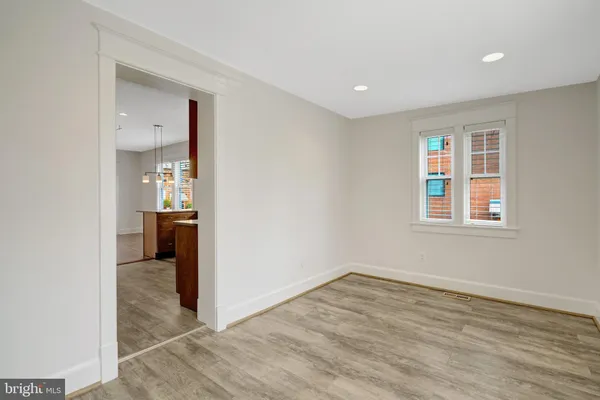 a view of a big room with windows and cabinet