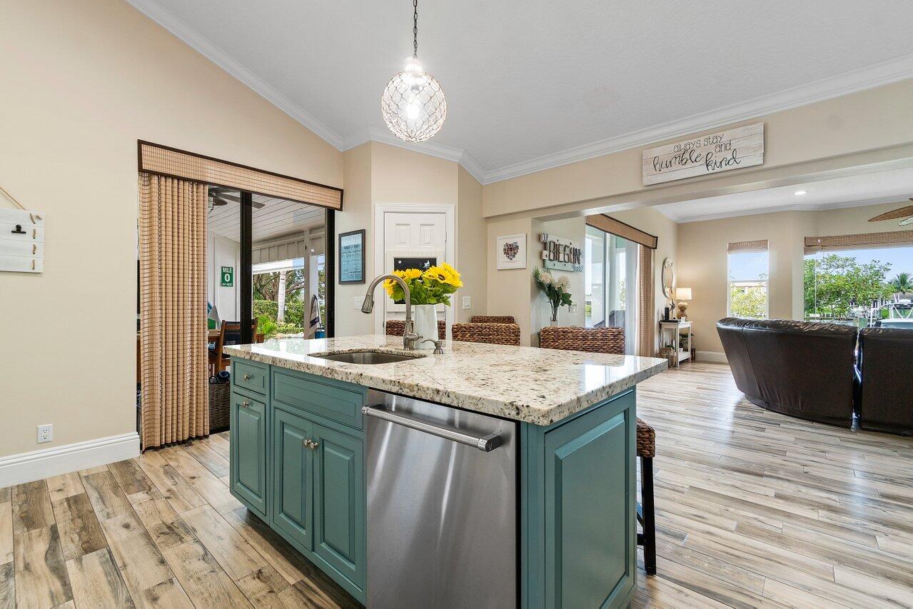18779 Southeast River Ridge Road Tequesta, FL 33469 - Photo 16 of 62 Kitchen to Family Room