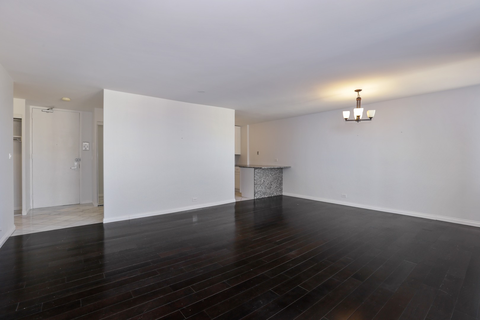 5701 North Sheridan Road, Unit 22H Chicago, IL 60660 - Photo 4 of 10 a view of empty room with wooden floor