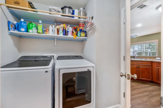 a utility room with dryer and washer