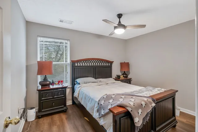 a bedroom with a bed and a tv