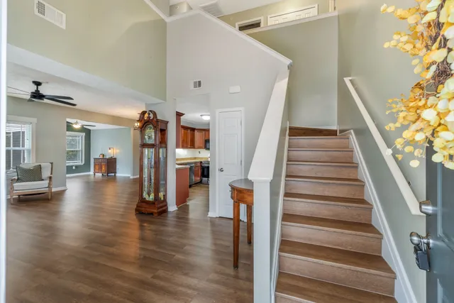 a view of entryway and hall with wooden floor