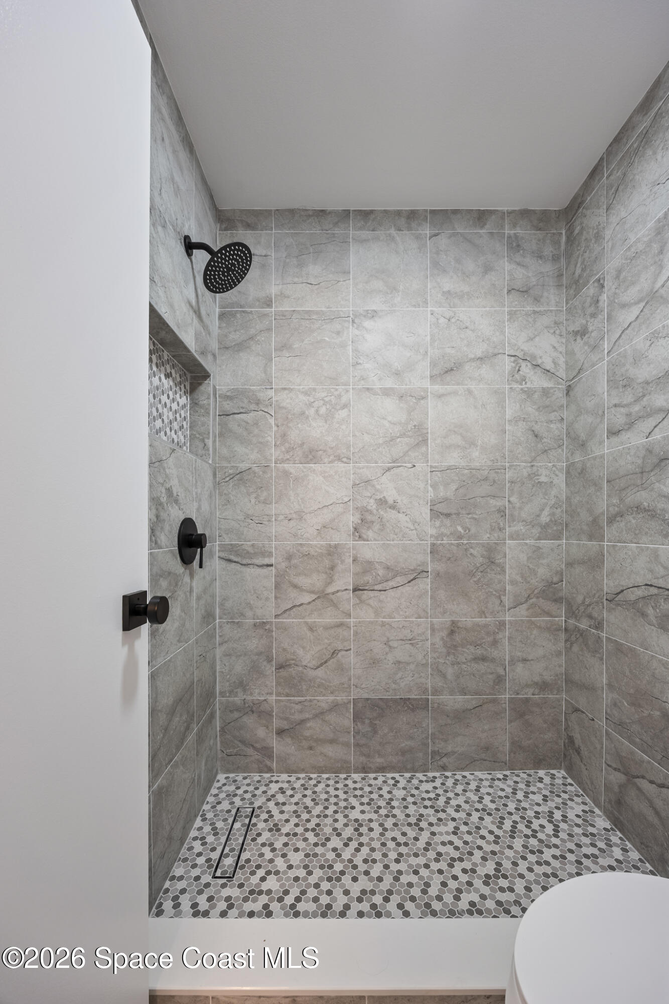 1411 Sheafe Avenue Northeast, Unit 101 Palm Bay, FL 32905 - Photo 14 of 24 a bathroom with a toilet