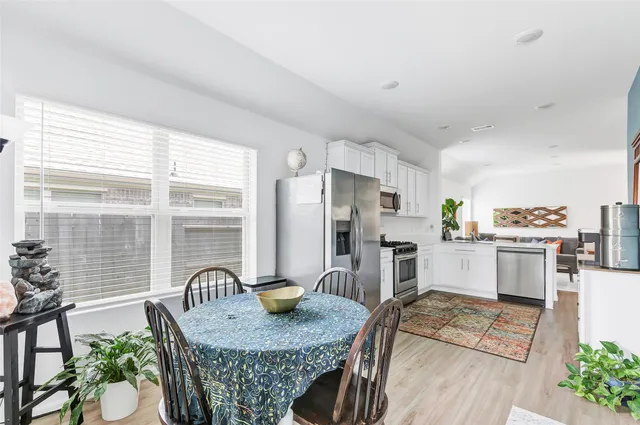 a dining room with furniture and windows