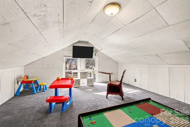 a view of a hallway with washer and dryer
