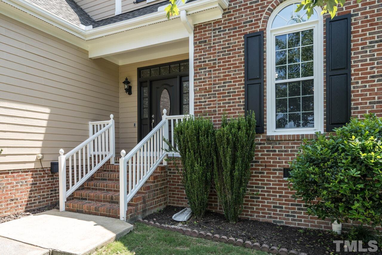 2017 Vintners Court Raleigh, NC 27610 - Photo 2 of 39 a view of a house with backyard and porch