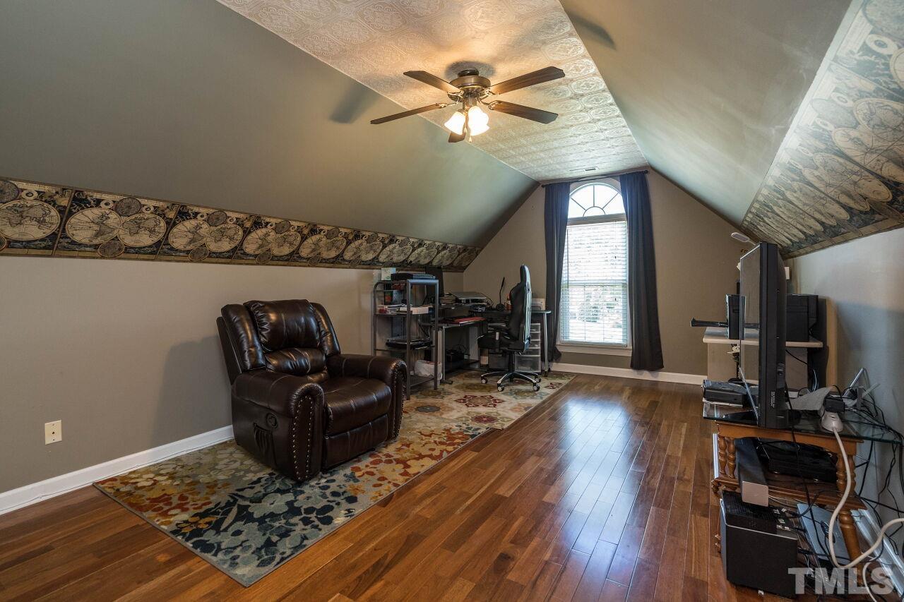 2017 Vintners Court Raleigh, NC 27610 - Photo 24 of 39 a living room with couch and a flat screen tv